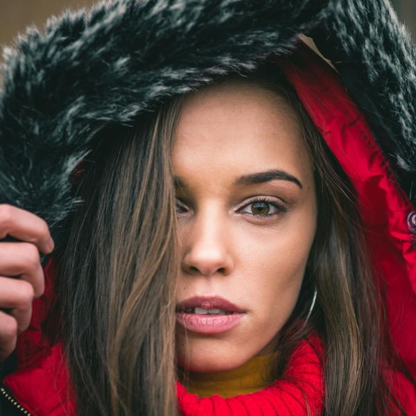 Close up of a person meditating with serene expression.